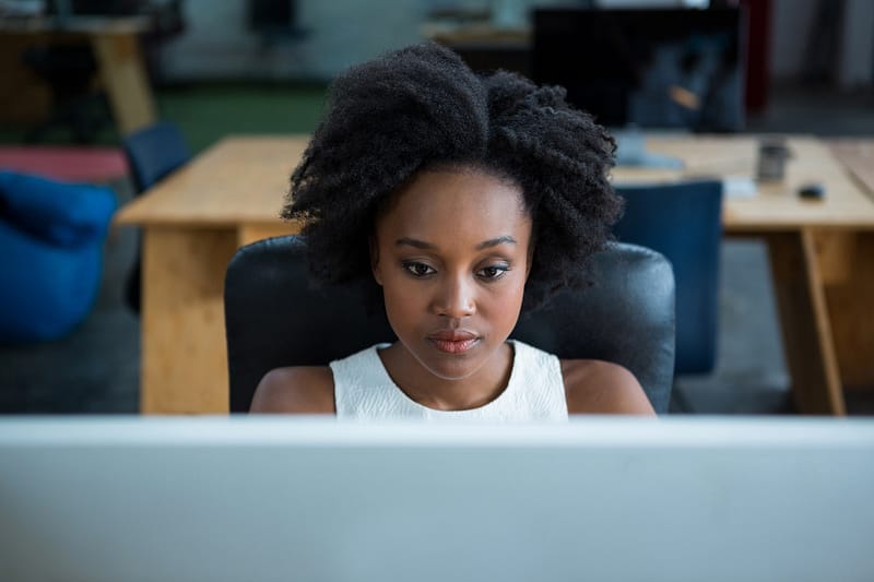 Female graphic designer using desktop pc