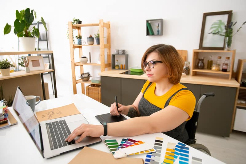 Using tablet while working on graphic design